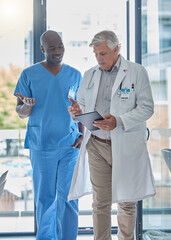 doctor, team and men with tablet in office for healthcare planning, health management and discussion