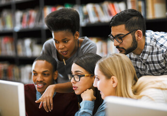 Canvas Print - University, people and website with computer in library for campus, research and online results. Academy, friends and students reading info on tech for communication, email and group assignment mark