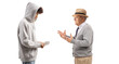 © Ljupco Smokovski - Grandfather talking to a teenage grandson standing and holding money