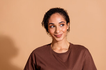 Poster - Photo of lovely sweet adorable woman wear stylish clothes look empty space isolated on beige color background