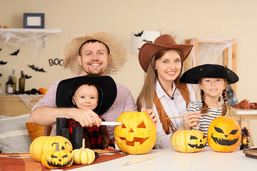 Poster - Happy family dressed for Halloween carving pumpkins at home