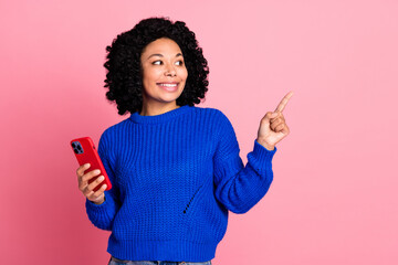 Wall Mural - Portrait of charming glad woman wear blue knitted trendy clothes recommend empty space isolated on pink color background