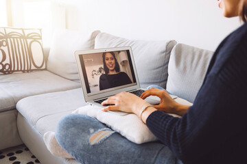 Wall Mural - Young female student having a video online lesson