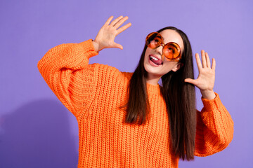 Poster - Photo of cheerful funny glad girl wear trendy orange clothes look empty space isolated on violet color background