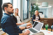 © VisualProduction - Close-up of focused employees, business people listening to their boss