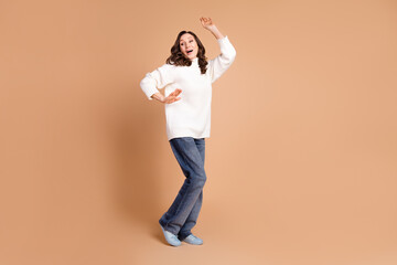 Sticker - Photo of positive charming retired woman wear trendy clothes have fun dance isolated on beige color background