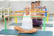 © JackF - Women of different ages take care of their health - doing Pilates with rubber bands in the gym