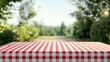 © red_orange_stock - The table is set with a classic red checkered tablecloth, surrounded by lush greenery, perfect for a relaxed outdoor gathering