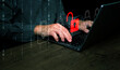 © OleCNX - Cybersecurity and safety concept. A padlock is unlocked or hacked on laptop computer keyboard.  Cyber attack,  unsecured network, and internet security