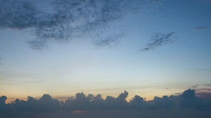 Wall Mural - Time lapse of dramatic sunrise with orange sky in a cloudy day.