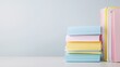 © Preecha - A detailed image of colorful office folders stacked neatly on a desk, set against a solid light background. The folders are in sharp focus with deep depth of field, leaving room for copy.