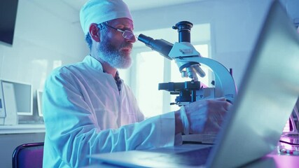 Wall Mural - chemist analyzing samples in modern laboratory with neon equipment