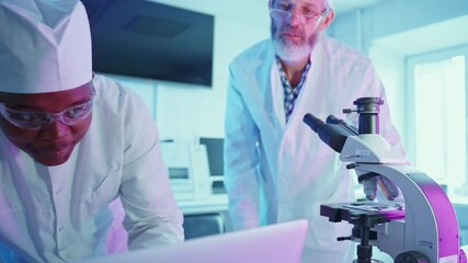 Wall Mural - researchers analyzing samples in a modern laboratory setting