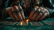 © fotogurme - Close-up of a fortune teller’s hands with elaborate rings and bracelets, hovering over tarot cards, candlelight flickering