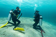 © Lukas Gojda - Diving instructor trains a novice who is learning to dive , underwater , Red sea .