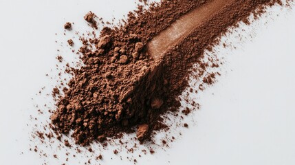 Cocoa powder artistically dusted on a smooth white background, creating a minimalist and elegant composition