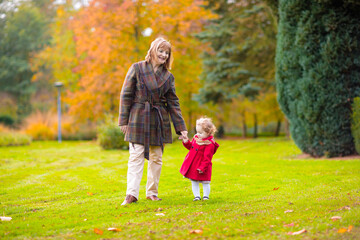 Wall Mural - Kids playing in autumn park