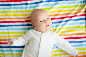 Wall Mural - little baby on rainbow blanket