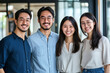 © Patcharaphon - Group of happy young Asian colleagues standing in office. Person, Team work and occupation concept
