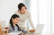 © amanaimages - パソコンでオンライン学習をする女の子と母親