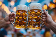 © Firn - Two beer mugs clinking at Oktoberfest