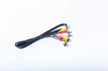 Red, yellow and white RCA plugs with black cables isolated on white background.