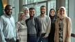 © MD Media - Diverse group of smiling Muslim multicultural businesspeople standing together in an office, showcasing inclusion diversity and collaboration within the corporate world. Middle eastern commercial