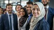 © MD Media - Diverse group of smiling Muslim multicultural businesspeople standing together in an office, showcasing inclusion diversity and collaboration within the corporate world. Middle eastern commercial