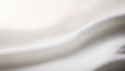 Wall Mural - close-up of a gently curved white fabric with soft lighting, showcasing a smooth texture and minimal