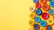 © BozStock - Colorful buttons arranged on a yellow background.
