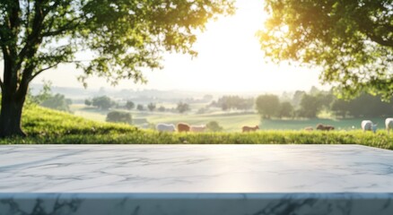 Wall Mural - A serene landscape with a marble table foreground and cows grazing in the background.