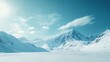 © BozStock - Snowy mountain range with a blue sky and white clouds.