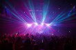 © Simon - A crowd in a concert hall or disco with scene stage lights in colorful tones, rock music show performance, with people silhouette, on dance floor during a concert festival.