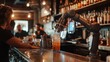 © sujitea - A robot bartender mixing drinks behind the counter at a trendy bar, with patrons watching.