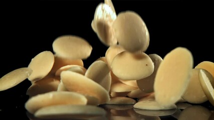 Canvas Print - White chocolate chips fly and fall. Filmed on a high-speed camera at 1000 fps. High quality FullHD footage