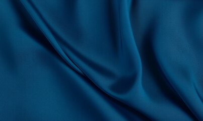 Dark blue satin fabric with elegant folds and silky texture. Luxurious textile concept for interior and fashion design. For banner, wallpaper, and greeting card