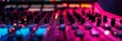 © Virtual Art Studio - Close-up of a sound mixer with glowing buttons and faders.
