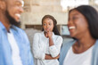 © Prostock-studio - Upset black woman watching her ex boyfriend happy in relations with new girlfriend, looking jealous on background, selective focus