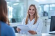 © Rashidi - Healthcare professional assisting a patient at a reception desk in a modern medical facility during a daytime visit