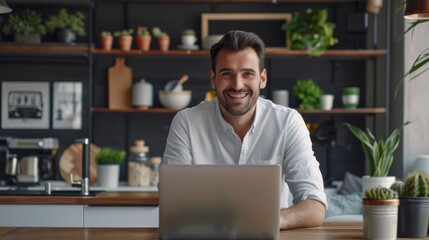 Poster - A man is sitting at a table with a laptop in front of him