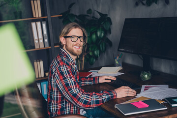 Photo of blond hair cyber security specialist man professional hacker sitting workplace using ips monitor computer and coding sql software
