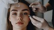 © Влада Яковенко - Cosmetologist making beauty injection to young woman, holding hand with syringe near eyes area