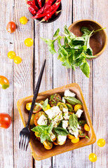 Wall Mural - Greek salad. Vegetable salad with feta cheese, tomato, olives, cucumber, red onion and olive oil.