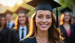 © abu - Portrait of a joyful female graduate with blurred students in the sunny background.