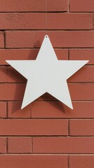 A white star hanging from a brick wall