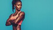 © CinimaticWorks - african american female fitness model with strong abs, colorful sportswear, sexy athletic woman workout banner, blue background and space for text