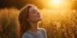 © StockUp - Woman standing in a sunlit field, embraced by the golden glow of sunset, evoking feelings of peace and hope.