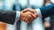 © Ariestia - A Close-up of Two Businessmen Shaking Hands