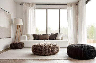 a white sofa, a knitted pouf and large windows. Scandinavian interior design