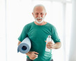 © Lumos sp - senior active exercise man training sport fitness mat gym fit pilates home stretching portrait healthy posing smiling happy elderly water bottle